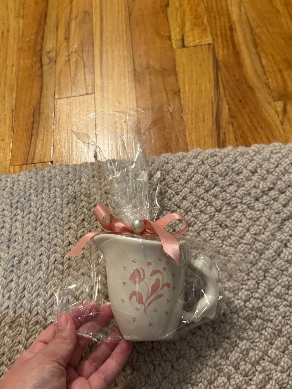 Anthropologie Cream Ceramic Mug with Pink Floral Design and Ribbon
